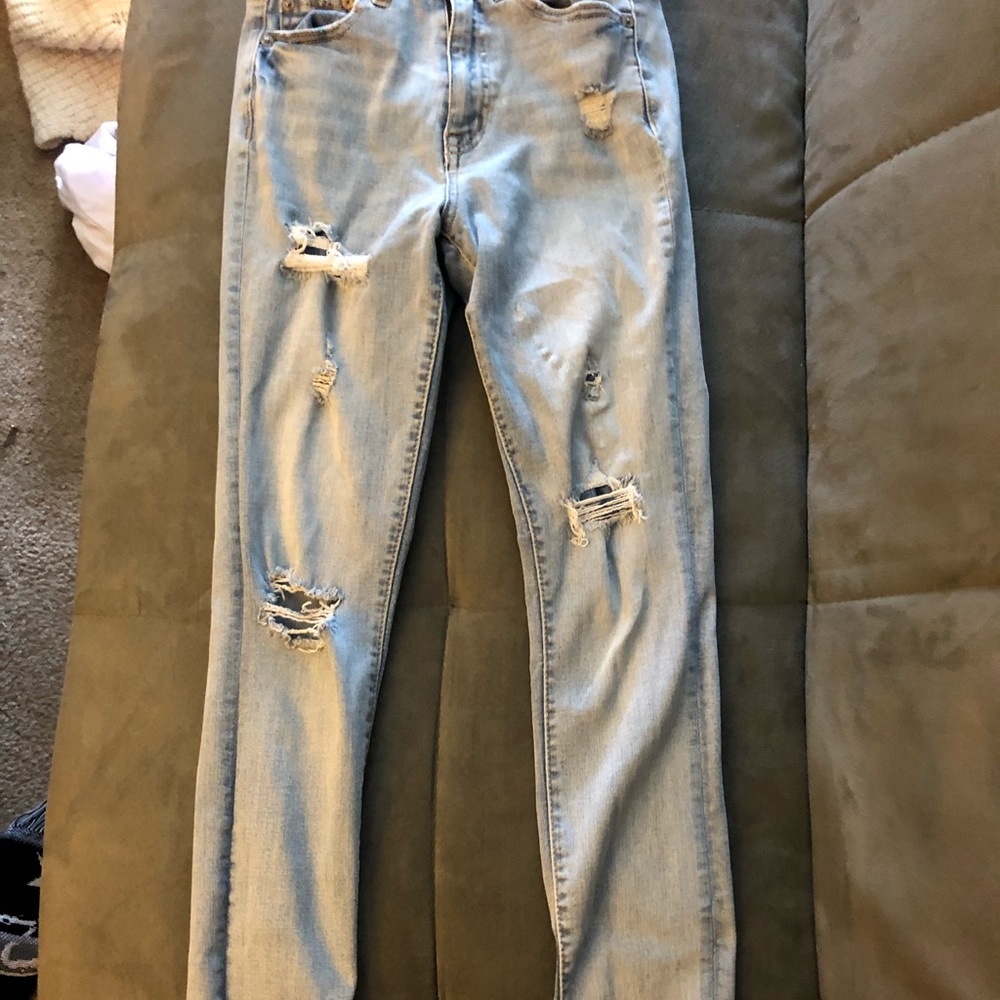 light blue ripped jeans :)